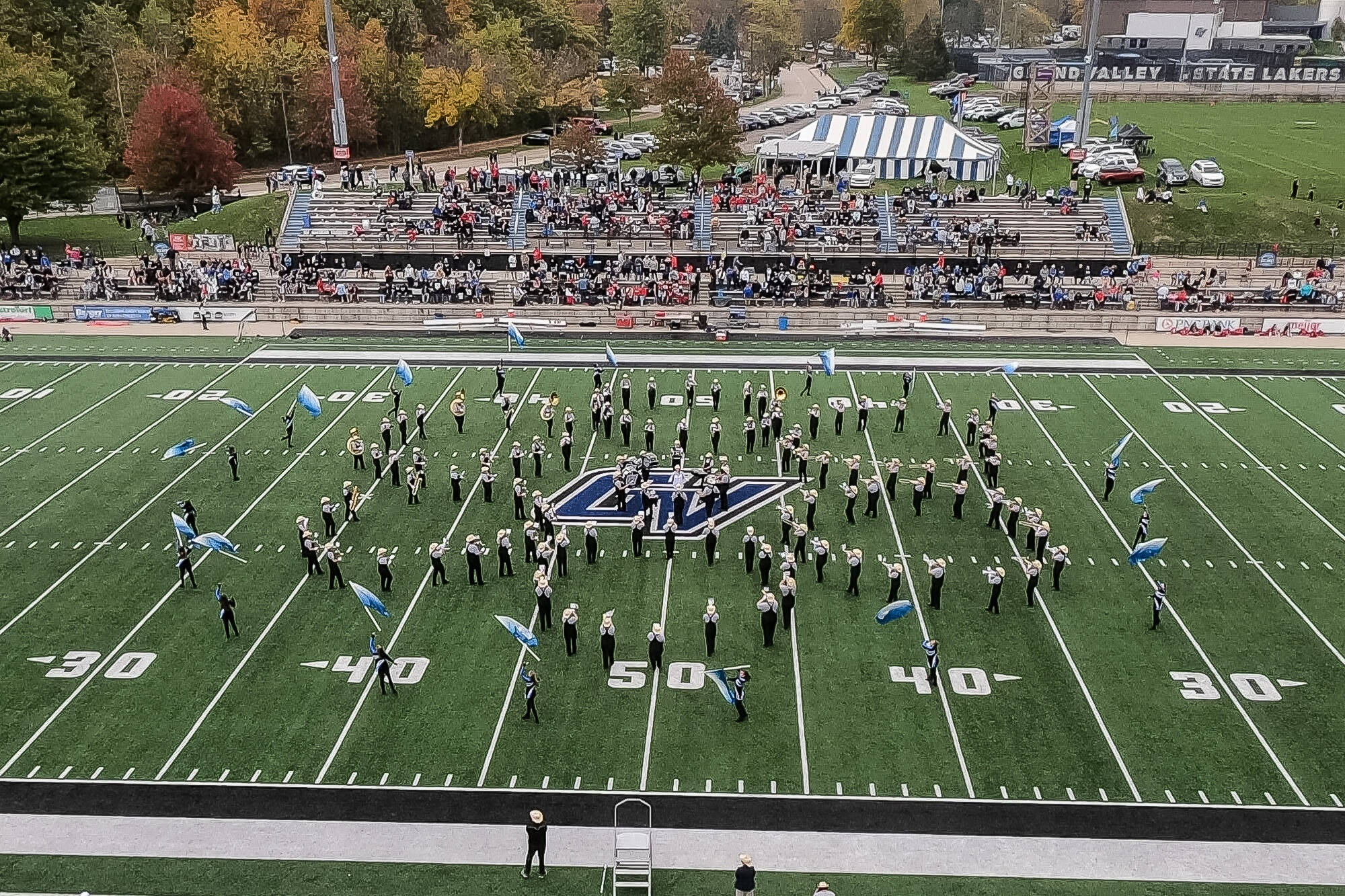 LMB forming 6 mini circles with the color guard forming a giant circle around the mini circles